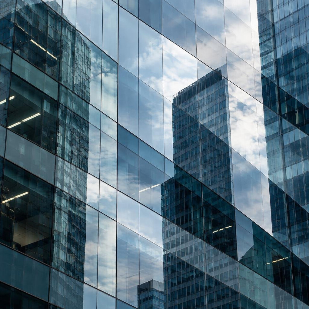 Abstract reflection on a modern glass building facade